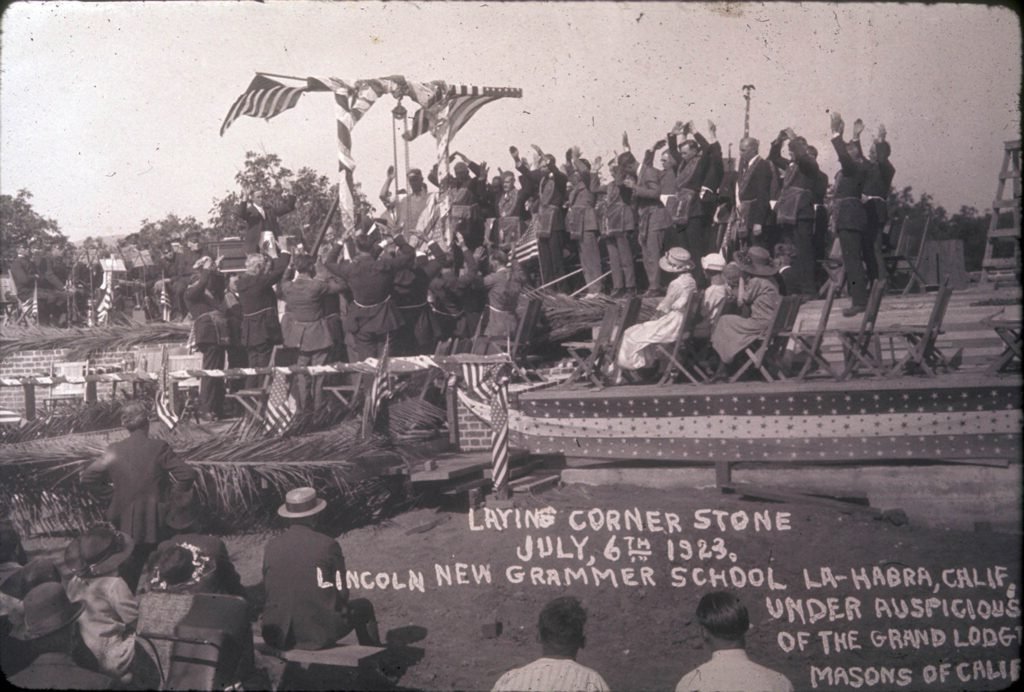 Cornerstone ceremony for Lincoln School in La Habra, Calif. on July 6, 1923. The school served students in kindergarten through sixth grades. This event was sponsored by the Grand Masonic Lodge, and a copper box containing historical items was placed within the cornerstone.
