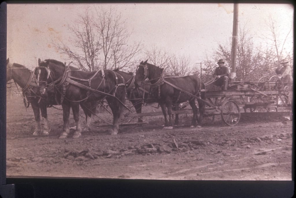 Road crew on Central Avenue, with view to the north in background, La Habra, Calif., in 1914 or 1915. The name of this street was later changed to La Habra Boulevard.